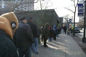 Parents waiting in the long line to enter the Harlem Education Fair on Feb. 28.
