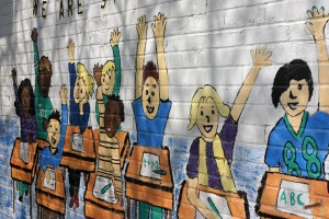 A mural that greets students and visitors to P.S. 46. Photo: Kyla Calvert/COVERING EDUCATION